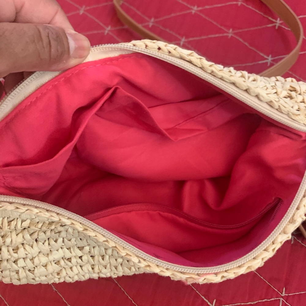 Nice and adjustable beige bag .